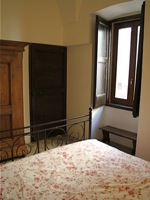 Bedroom with original door and shutters