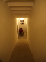 Stairway leading from kitchen to 1st floor